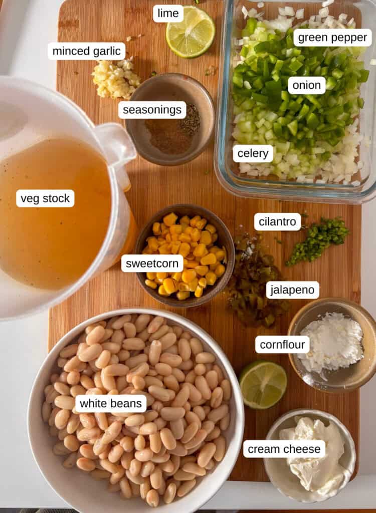 ingredients list for white bean chili: minced garlic, lime, green pepper, onion, celery, seasonings, veg stock, sweetcorn, cilantro, jalapeno, cornflour, white beans, cream cheese
