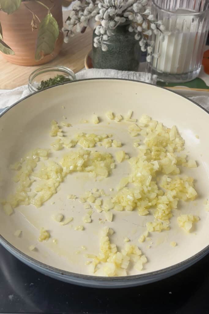 diced onion added to a casserole pan with a little olive oil