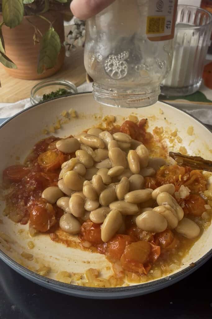 butter beans are added to the pan after the tomatoes have cooked and softened
