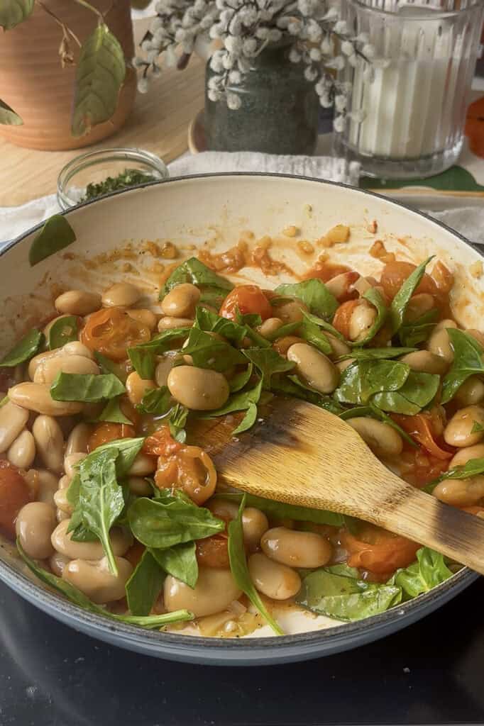 fresh chopped spinach is added to the butter beans dish