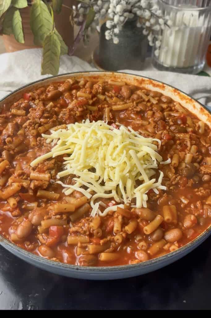 cheese is stirred into the pan once the pasta is tender, then topped with cheese and grilled until melted and golden