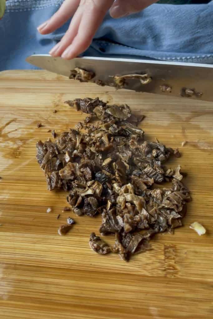 the dried porcini mushrooms are removed from the stock once soaked and diced finely to be added to the risotto