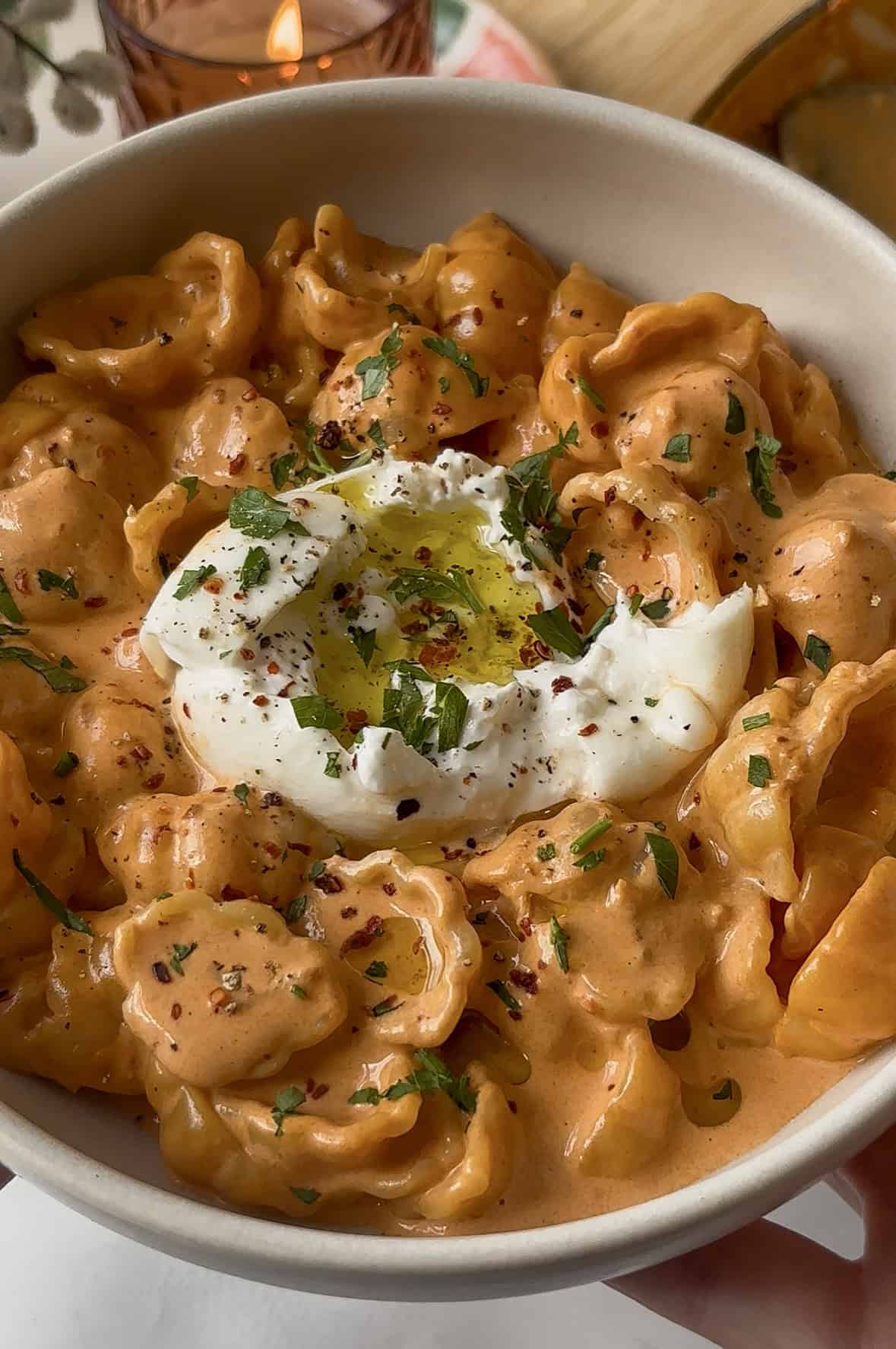vodka pasta with shells and a mini burrata ball on top