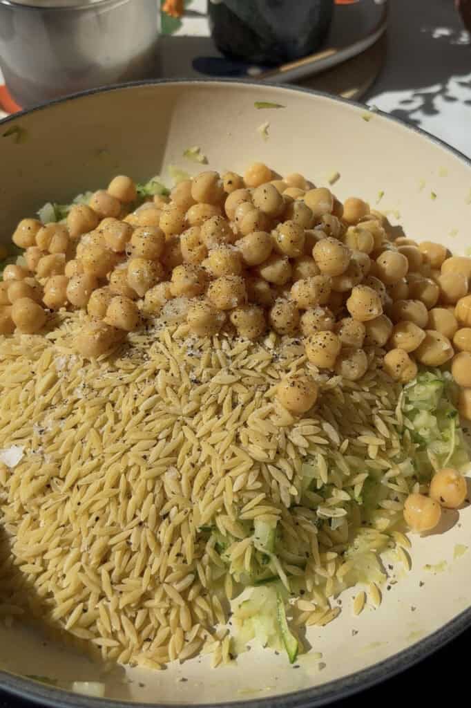 dried orzo, drained chickpeas, and salt and pepper added to grated zucchini and diced onions