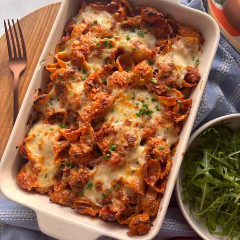 a casserole dish of creamy sausage pasta bake