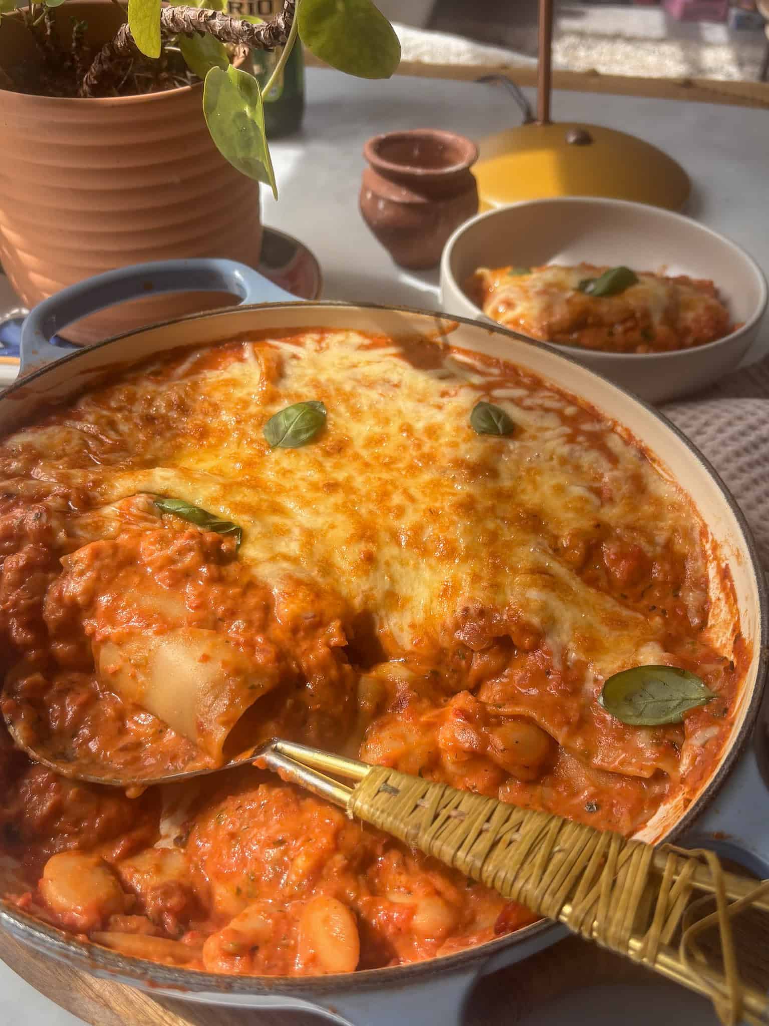 butter bean lasagne, with the bowl in the back of it.