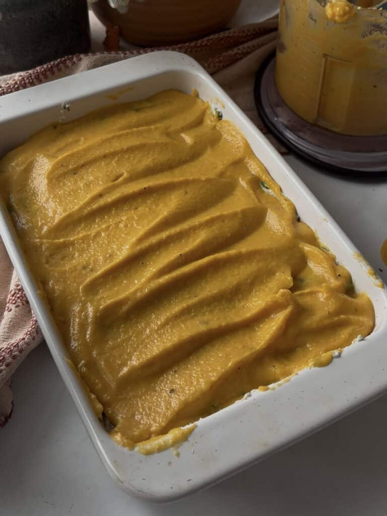 a layer of butternut squash sauce added to the butternut squash and spinach lasagne