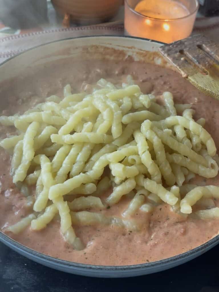 cooked pasta added to the boursin cheese sauce