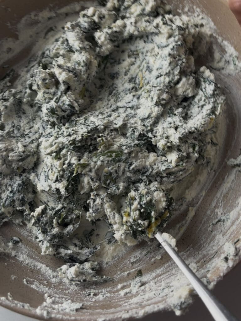 the spinach and ricotta ingredients mixed in a bowl