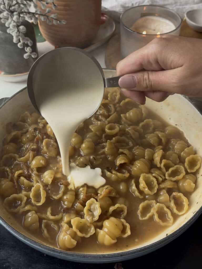 cream is added to the french onion pasta - where the pasta is cooked directly within the sauce, for a thick and creamy finish